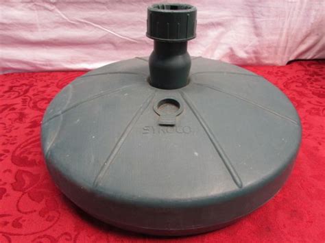 This umbrella stand, filled with sand, handles my 11' umbrellas no problem. Lot Detail - HEAVY DUTY UMBRELLA STAND