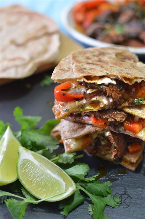 Cook, stirring occasionally, until the peppers and onions are softened and slightly charred round the edges; Spicy Fajita Steak Quesadilla | The Flavor Bender