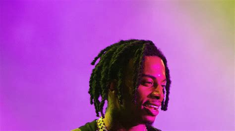 Playboi Carti In Purple Background Wearing Chains On Neck
