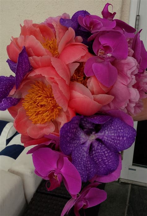 A Tropical Bouquet Of Coral Charm Peonies Vanda And Phaeleanopsis