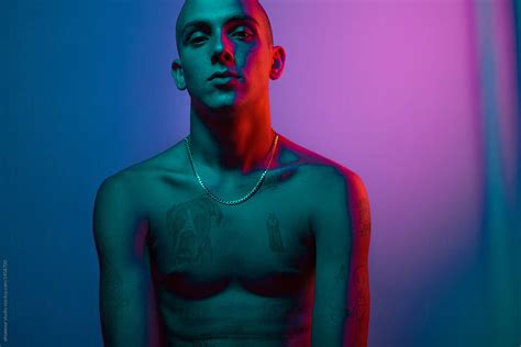 Shirtless Man Under Neon Lights By Stocksy Contributor Ohlamour
