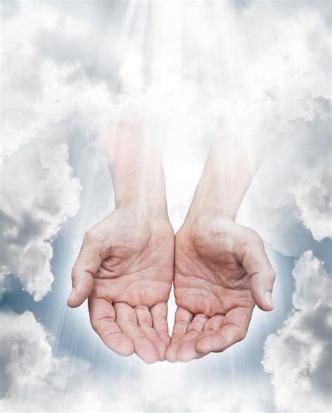 Hands Of God Hands Coming From A Cloudy Sky With Streaming Light