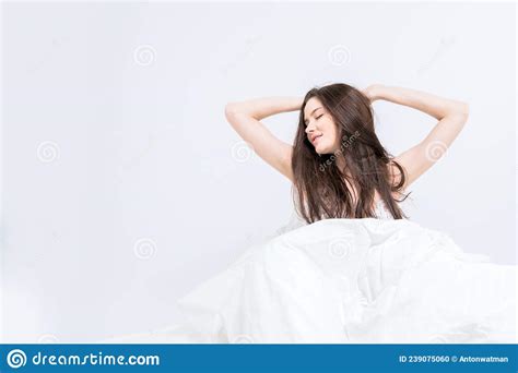 A Young Beautiful Brunette Woman Wakes Up In Her Bed Fully Rested A