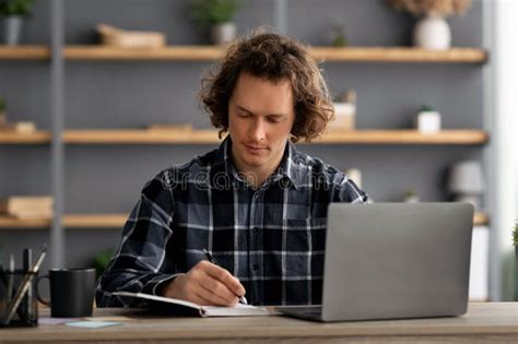 Serious Business Guy Working On Laptop Taking Notes In Office Stock Image Image Of Internet