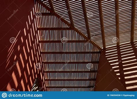 A Wooden Slatted Roof Feature At A Small Hotel Next To A Beach On The