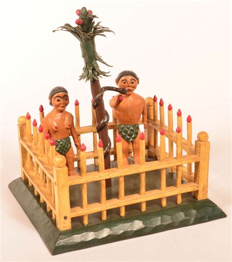 Two Figurines Are Standing On A Wooden Fence And Holding Onto A Tree Branch