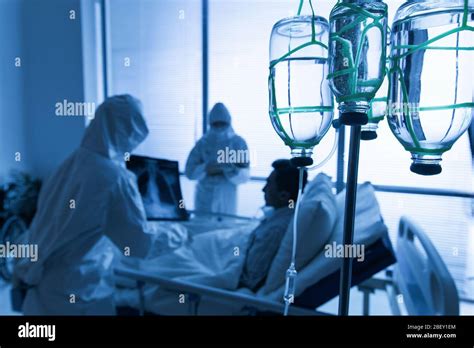 Doctors Treating Patients In The Ward Stock Photo Alamy