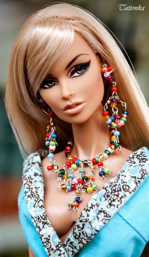 A Barbie Doll With Blonde Hair And Colorful Jewelry