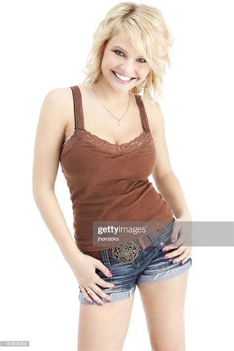 Cheerful Young Woman In Shorts And Tank Top High Res Stock