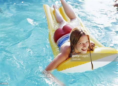 Teenage Girl Lying On Inflatable Raft In Pool Portrait Photo Getty Images