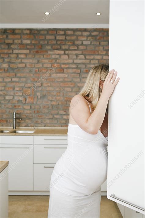 Pregnant Woman Looking In Fridge Stock Image F003 5620 Science Photo Library