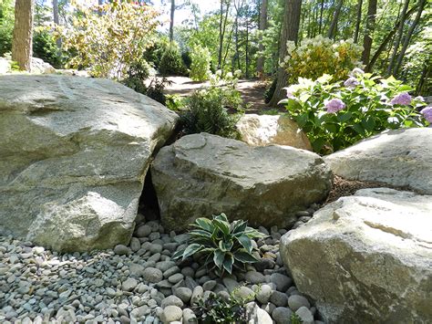 Portland landscape designer, ben bowen, shares his tips in this article originally on landscaping arrange your boulders in a variety of ways setting all the boulders in a landscape with the flat side up will create a mundane and methodical look that does. Landscaping with Boulders | Bolton Landscape Design ...