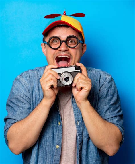 Young Nerd Man With Noob Hat Holding Camera Stock Image Image Of