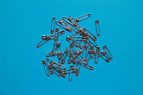 Safety Pins In Blue Plastic Box On Blue Background Stock Photo Image