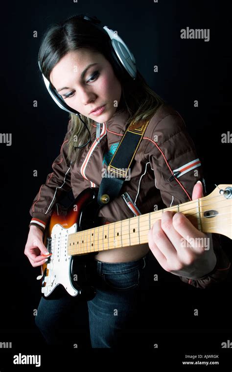 Brunette Caucasian Young Woman Playing Electric Guitar Stock Photo Alamy