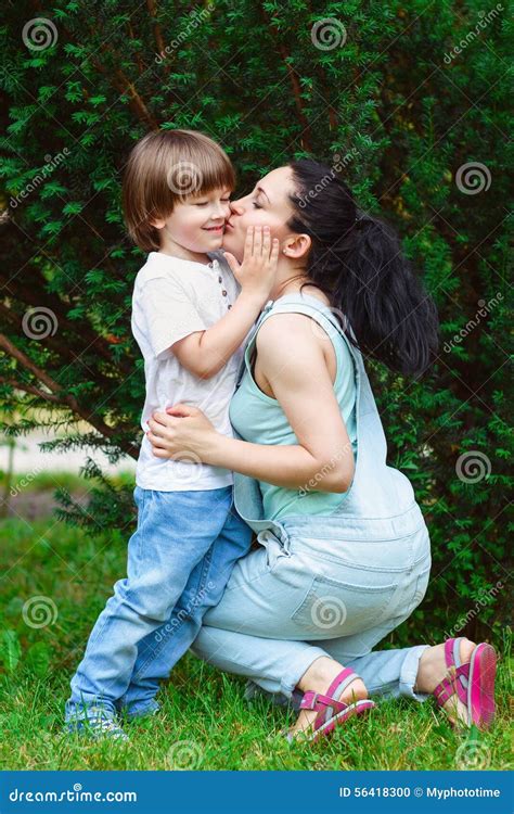 Loving Mother Kissing Her Son Stock Photo Image Of Hispanic Happy