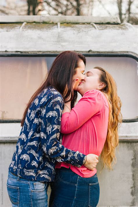 Lesbian Couple Kiss Each Other By Stocksy Contributor Branislava