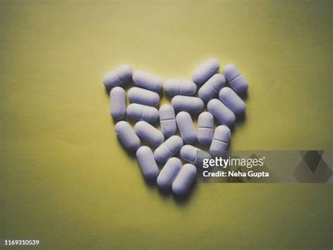 Yellow Pill With Heart Photos And Premium High Res Pictures Getty Images