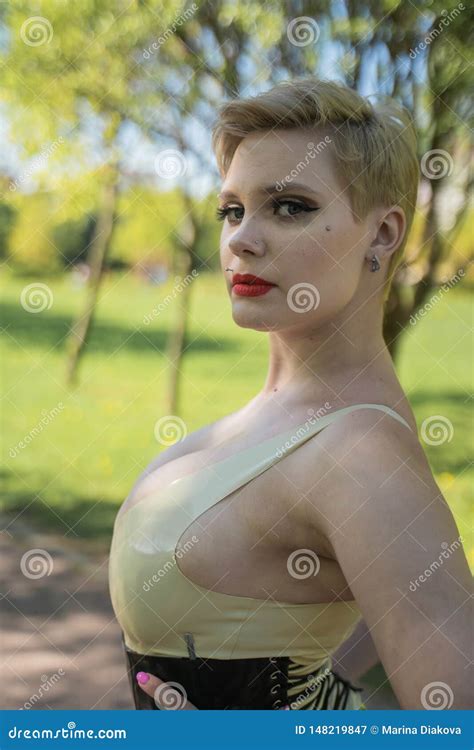 Hot Curvy Woman With Short Hair And Big Boobs Wearing Latex Kinky