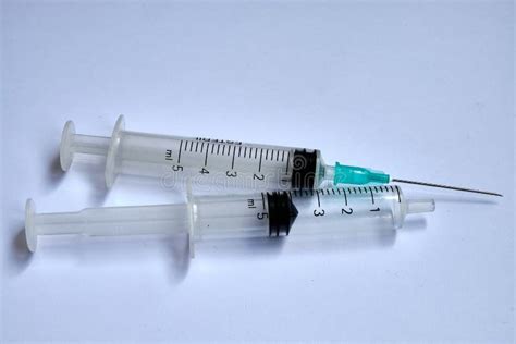 A Small Syringe Into Which A Hollow Sharp Pointed Bevel Cut Needle Is
