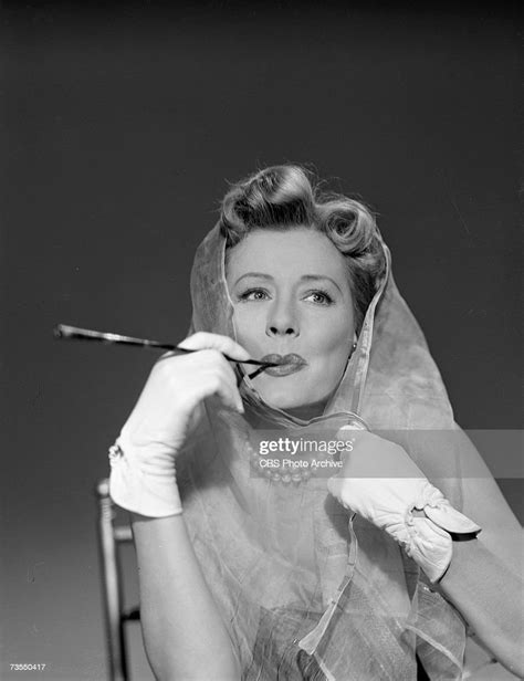 american actress irene dunne smokes a cigarette in a long cigarette news photo getty images