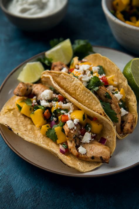 This ginger, mint, and lime marinade was born one summer of that most dignified of lineages: Chili Lime Marinated Chicken Tacos With Mango Salsa - Will ...
