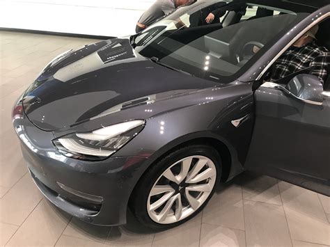 Tesla drops price of model 3 to 47600 in canada. Tesla Model 3s start appearing at all Canadian showrooms