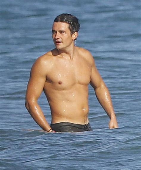 Shirtless Orlando Bloom Swims In Malibu With His Friends Flaunts Buff Chest And Abs Tattoo