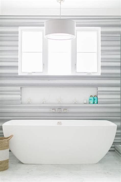 It makes for great decorative wall and floor finish and can be used sparsely as well as extensively depending but there are also sinks and bathtubs available in marble. A window framed by a wall covered in Delano Marble is ...
