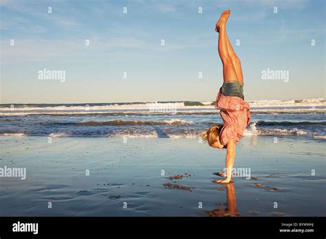 Young Girl Handstand On Sand Stock Photos And Young Girl Handstand On