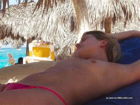 Wild Blonde Girlfriend Sunbathing Topless For Her Horny Pal On The Beach