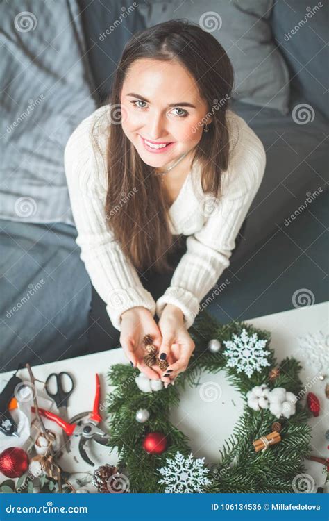 Cheerful Woman With Christmas Decorations And Garland Stock Photo