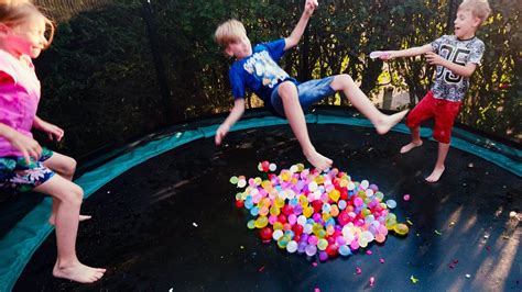 Water Balloons Splash Fun On Trampoline For Kids In Slow Motion Youtube