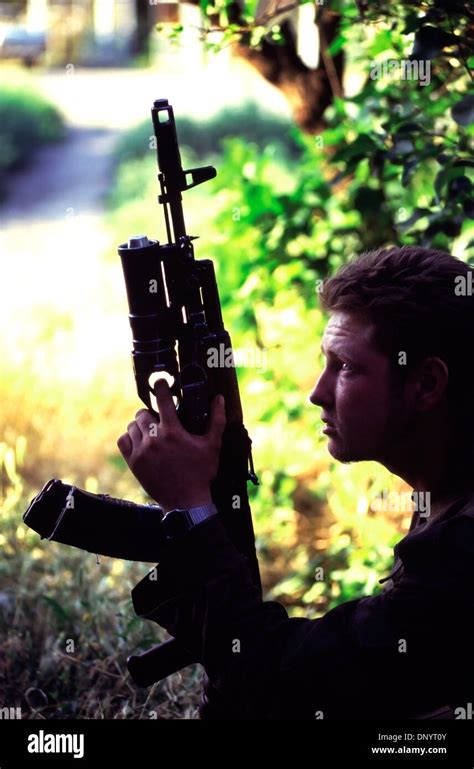 Russian Interior Ministry Soldier Holding Kalashnikov Rifle Near The