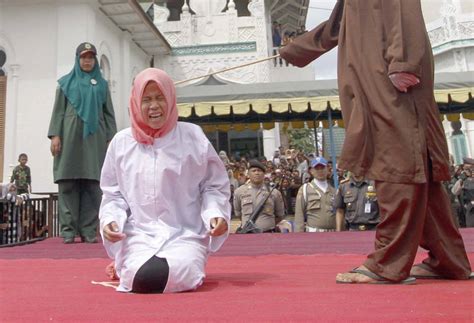 Woman Caned In Front Of Crowd For Being Too Close To Fellow Student