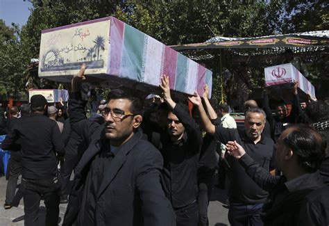 Iranians Attend Funeral For Soldiers Killed In Iran Iraq War