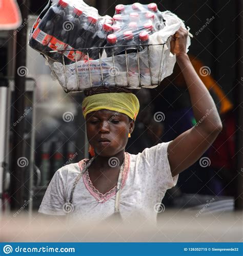 unidentified ghanaian woman carries a basket with bottles of wa editorial image image of