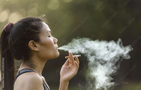 Woman Smoking A Cigarette Stock Photo Adobe Stock