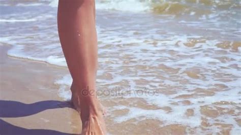 Womans Legs On The Sand Beach And Sea Video By Zamuruev Stock