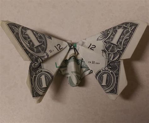 An Origami Butterfly Made Out Of One Dollar Bill