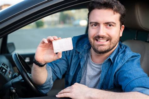 Cheerful Man Holding Driver License In His Car Stock Image Image Of