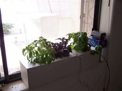 Hydroponic gardening can fulfill your desire to raise a garden without actually getting your hands in the dirt. Build your own hydroponic window herb garden system
