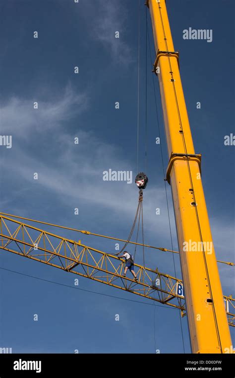 View Of Crane Lifting Crane Boom Into Position For Assembly With