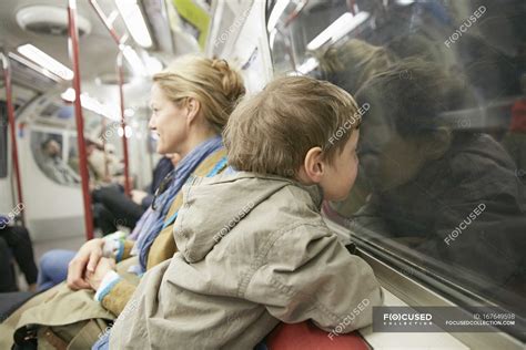 Mother And Son Traveling In Subway Together London Uk — Journey Train Compartment Stock