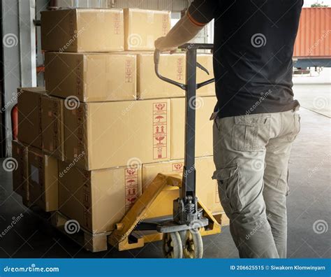 Cargo Shipment Boxes Warehousing Worker Working With Hand Pallet Truck Unloading Cargo Boxes
