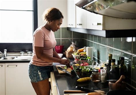 Premium Photo Black Woman Cooking In The Kitchen