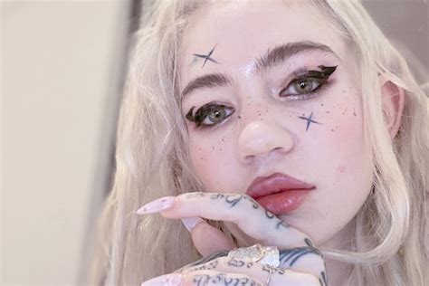Grimes Gets Wild New Tattoo Plans To Become Post Human Exclaim