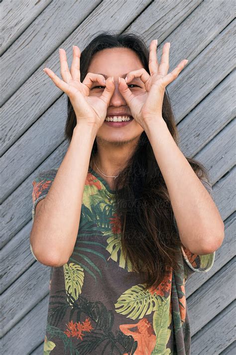 Asian Woman With Ok Gesture On Eyes By Danil Nevsky
