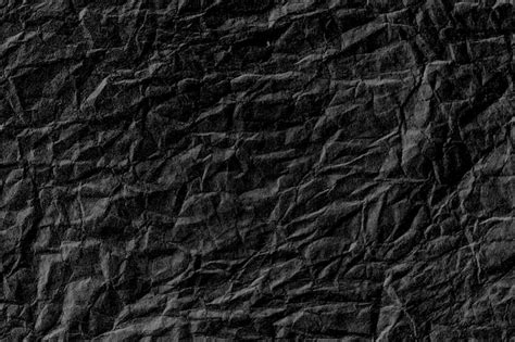 Premium Photo Crumpled Black Paper Textured Background