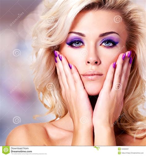 Beautiful Woman With Purple Nails And Glamour Makeup Stock